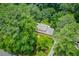 Aerial view of a beautiful home nestled in a serene, wooded setting, showcasing its privacy at 2291 Smokehouse Path, Lawrenceville, GA 30044