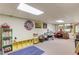 Finished basement with bright lighting, a blue rug, and plenty of room for activities at 2291 Smokehouse Path, Lawrenceville, GA 30044