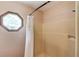 Bathroom with octagon window and shower/tub combo with shower curtain at 2291 Smokehouse Path, Lawrenceville, GA 30044