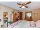 Comfortable bedroom with ceiling fan and quaint decor at 2291 Smokehouse Path, Lawrenceville, GA 30044