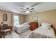 Cozy bedroom featuring two twin beds, a ceiling fan, and neutral decor for a restful retreat at 2291 Smokehouse Path, Lawrenceville, GA 30044
