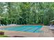 Community pool with plenty of seating, surrounded by lush greenery, for outdoor relaxation at 2291 Smokehouse Path, Lawrenceville, GA 30044