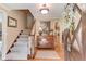 Inviting foyer with hardwood floors, a staircase, and a view into other living spaces of the home at 2291 Smokehouse Path, Lawrenceville, GA 30044