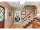 Elegant foyer showcasing hardwood floors, a staircase, and seamless flow into the living room at 2291 Smokehouse Path, Lawrenceville, GA 30044