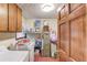 Bright laundry room features front load washer and dryer, overhead cabinets, and lots of storage at 2291 Smokehouse Path, Lawrenceville, GA 30044