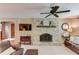 Warm living room with brick fireplace and comfortable seating, perfect for gatherings at 2291 Smokehouse Path, Lawrenceville, GA 30044