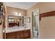 Main bathroom features a large vanity, mirror and a toilet behind an open doorway at 2291 Smokehouse Path, Lawrenceville, GA 30044