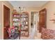 Comfortable sitting room or office with unique decor and ample shelving for storage at 2291 Smokehouse Path, Lawrenceville, GA 30044