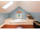 Charming finished attic with platform bed, skylight, and colorful decor at 3072 Dale Ne Dr, Atlanta, GA 30305