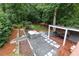 Aerial view of the backyard features a hot tub, outdoor kitchen, and manicured landscaping at 3072 Dale Ne Dr, Atlanta, GA 30305