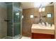 Modern bathroom featuring a glass shower, tile surround, and a stone vanity with sink at 3072 Dale Ne Dr, Atlanta, GA 30305