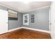 Cozy bedroom with neutral walls, hardwood floors, and natural lighting at 3072 Dale Ne Dr, Atlanta, GA 30305