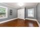 Bright bedroom with hardwood floors, white trim, and ample natural light at 3072 Dale Ne Dr, Atlanta, GA 30305