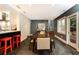 Spacious dining room adjacent to the kitchen featuring stone floors and access to the backyard at 3072 Dale Ne Dr, Atlanta, GA 30305