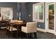 Elegant dining room with slate floors, stylish decor, and access to the outdoor space at 3072 Dale Ne Dr, Atlanta, GA 30305