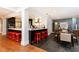 Open-concept layout with kitchen island, dining area, and hardwood floors throughout the space at 3072 Dale Ne Dr, Atlanta, GA 30305