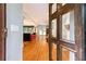 View from doorway into the open-concept living and kitchen area with hardwood floors at 3072 Dale Ne Dr, Atlanta, GA 30305