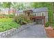 Charming home showcasing stone retaining wall and covered parking at 3072 Dale Ne Dr, Atlanta, GA 30305
