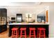 Kitchen island with barstool seating, stainless steel appliances, and contemporary design at 3072 Dale Ne Dr, Atlanta, GA 30305