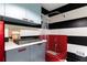 Modern laundry room with a dog washing station, black and white stripes, and red trim at 3072 Dale Ne Dr, Atlanta, GA 30305