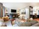 Cozy living room features a fireplace, modern furniture, and open access to the kitchen at 3072 Dale Ne Dr, Atlanta, GA 30305