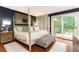 A luxurious main bedroom boasts a four-poster bed and sliding doors to a private balcony at 3072 Dale Ne Dr, Atlanta, GA 30305