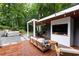 Relaxing outdoor living area with a hot tub, grill, and a cozy seating area perfect for entertaining at 3072 Dale Ne Dr, Atlanta, GA 30305