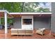 Inviting outdoor living space featuring a covered deck with comfortable seating and a built-in entertainment center at 3072 Dale Ne Dr, Atlanta, GA 30305