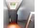Finished stairwell with a skylight and hardwood stairs at 3072 Dale Ne Dr, Atlanta, GA 30305