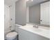 Bright bathroom with a large mirror, modern vanity and combination tub and shower at 3236 Henderson Mill Rd # 5, Atlanta, GA 30341