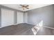 Bedroom with a ceiling fan, natural light, and stylish gray flooring at 3236 Henderson Mill Rd # 5, Atlanta, GA 30341
