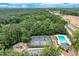 Overhead view of community amenities, including tennis courts, a playground, and a refreshing outdoor swimming pool at 2105 Huntington Hills Trce, Buford, GA 30519