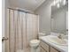 Cozy bathroom features a shower with curtain and classic vanity at 2105 Huntington Hills Trce, Buford, GA 30519
