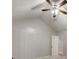 Cozy bedroom with vaulted ceiling, ceiling fan, and neutral color palette at 2105 Huntington Hills Trce, Buford, GA 30519
