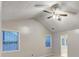 Bright bedroom with vaulted ceiling, fan, and large windows at 2105 Huntington Hills Trce, Buford, GA 30519