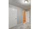 Bedroom with gray walls, white doors and neutral flooring, perfect for relaxation at 2105 Huntington Hills Trce, Buford, GA 30519