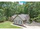 Well-maintained home features manicured lawn, two-car garage and neutral siding at 2105 Huntington Hills Trce, Buford, GA 30519