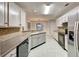 Spacious kitchen with gray countertops, tile backsplash, and stainless steel appliances at 2105 Huntington Hills Trce, Buford, GA 30519