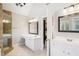 Modern bathroom with double vanity, glass shower, and neutral color scheme at 4365 Mantle Ridge Dr, Cumming, GA 30041