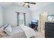 Bedroom with vaulted ceilings, fan, and view of the backyard at 4365 Mantle Ridge Dr, Cumming, GA 30041