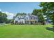 Beautiful two-story home with landscaped yard and mature trees at 4365 Mantle Ridge Dr, Cumming, GA 30041