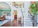 Grand two-story foyer with hardwood floors, elegant staircase, and views into the dining and living areas at 4365 Mantle Ridge Dr, Cumming, GA 30041