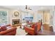 Comfortable living room boasts hardwood floors, a stone fireplace, and an open layout for entertaining at 4365 Mantle Ridge Dr, Cumming, GA 30041