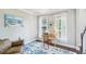 Home office with hardwood floors, bright lighting, and a comfortable workspace near large windows at 4365 Mantle Ridge Dr, Cumming, GA 30041