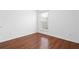 Bedroom with hardwood floors, a window with blinds, and electrical outlets at 4874 Seldon Se Way, Smyrna, GA 30080
