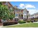 Charming townhome with a well-maintained lawn, manicured bushes, brick and stone facade, and inviting front entrance at 4874 Seldon Se Way, Smyrna, GA 30080