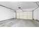 Spacious two car garage featuring an automatic garage door opener and ample room for vehicles and storage at 4874 Seldon Se Way, Smyrna, GA 30080