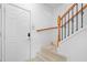 Hallway and stairway entrance featuring white trim and carpeted stairs at 4874 Seldon Se Way, Smyrna, GA 30080
