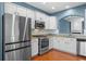 Elegant kitchen features stainless steel appliances, including a modern refrigerator, and granite countertops at 4874 Seldon Se Way, Smyrna, GA 30080