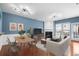 Stylish living room with hardwood floors, a fireplace, and modern lighting fixtures; perfect for relaxing or entertaining guests at 4874 Seldon Se Way, Smyrna, GA 30080